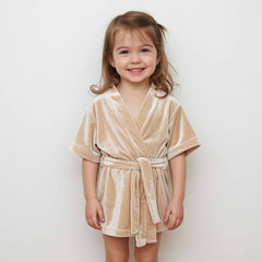 wearing a short-sleeve beige velvet robe with a belt