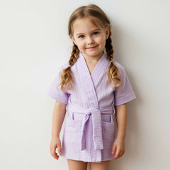 Young girl wearing a light purple cotton robe