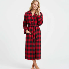 wearing a long red and black buffalo plaid fleece robe with pockets and a waist tie