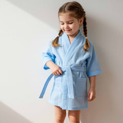 wearing a light blue waffle-knit robe