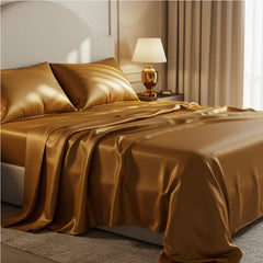 Opulent royal gold satin bed sheets featuring a liquid gloss texture under warm bedroom lighting
