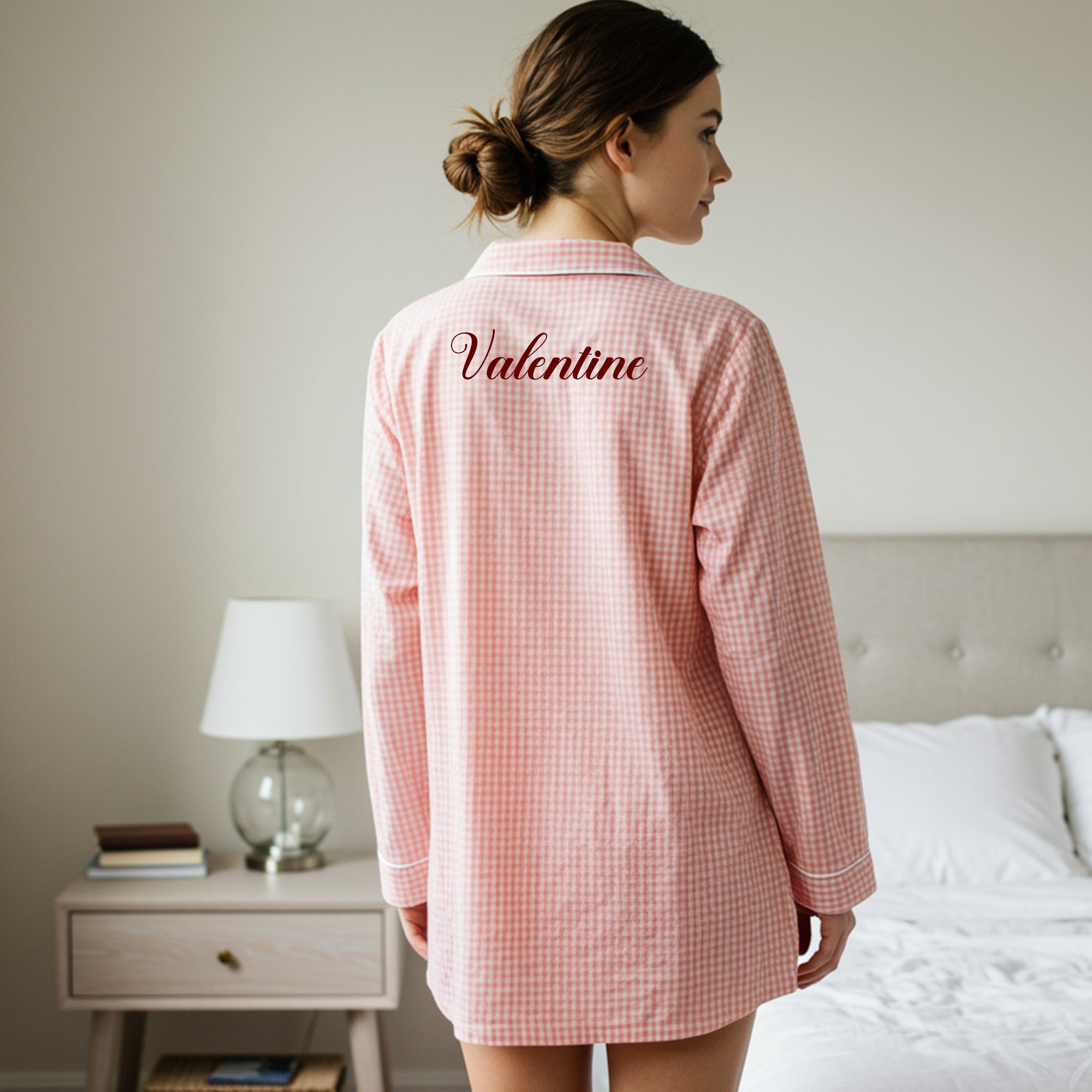 Back view of pink gingham nightshirt with elegant Valentine script embroidery in dark red