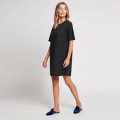 wearing a black long tshirt dress 