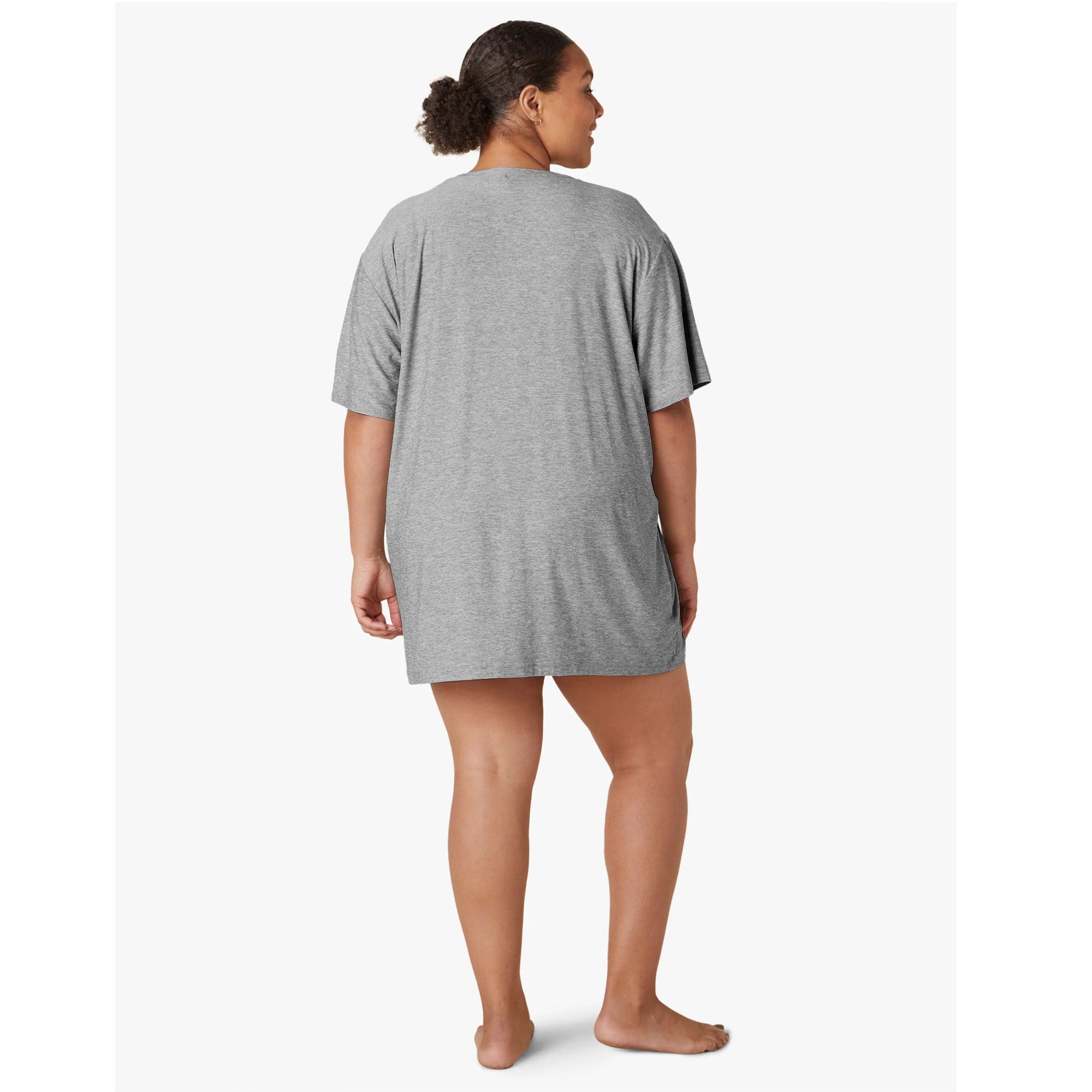 Woman wearing a gray long t-shirt 