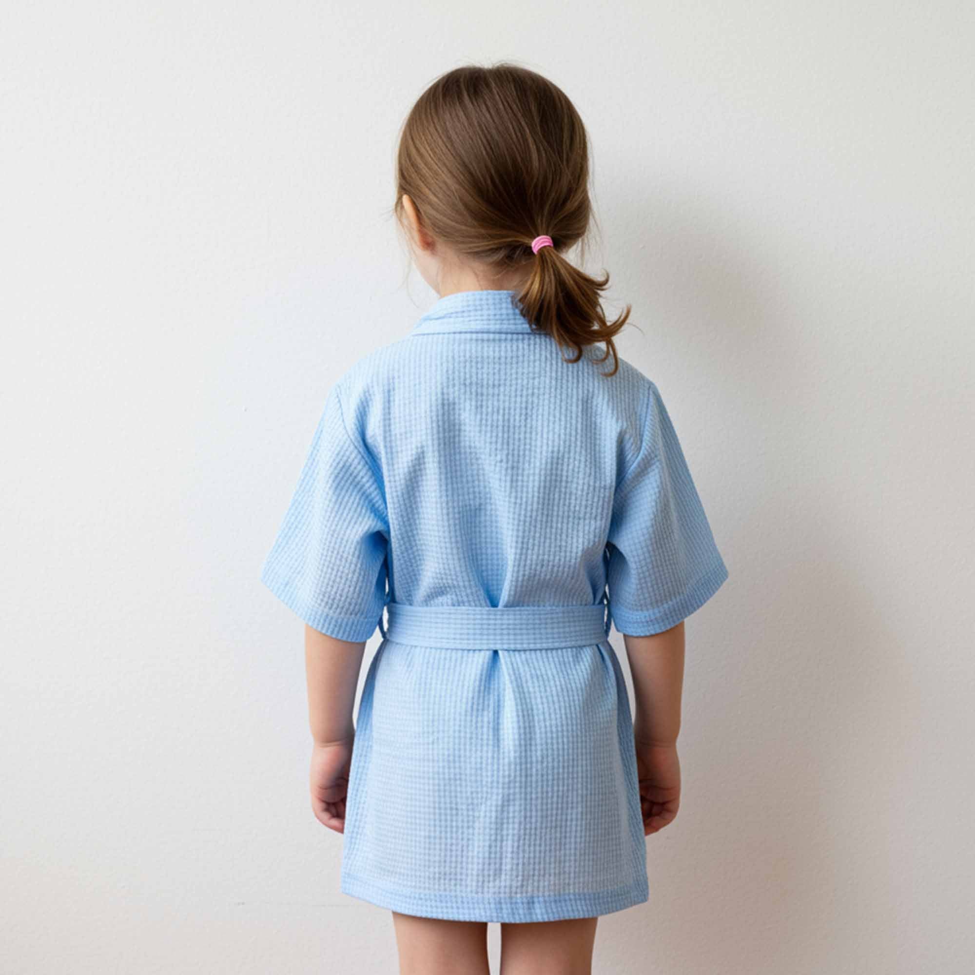Back view of a light blue waffle-knit robe with a tied belt.