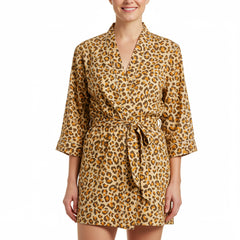 Woman wearing a leopard print dress on a white background