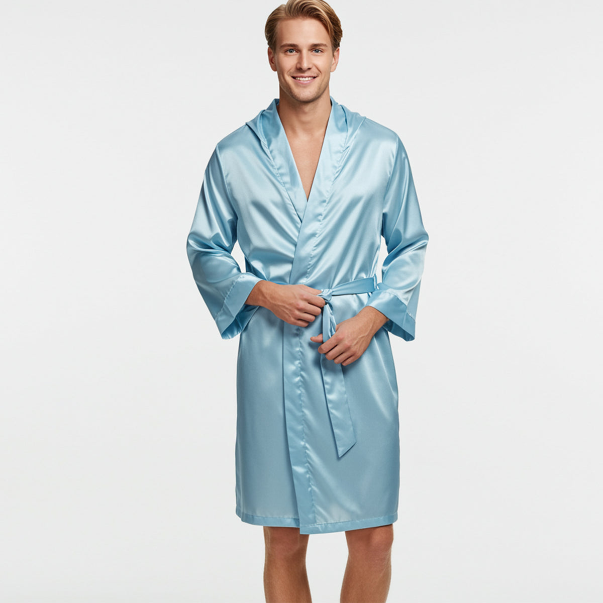 Man wearing a light blue satin robe on a plain background