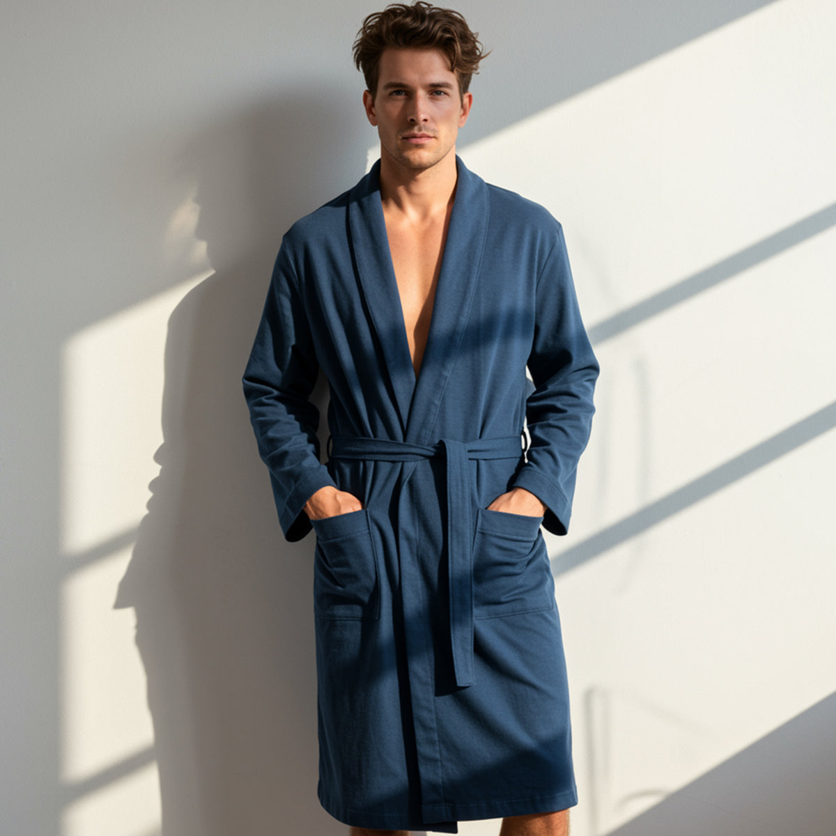 Man wearing a navy blue cotton bathrobe