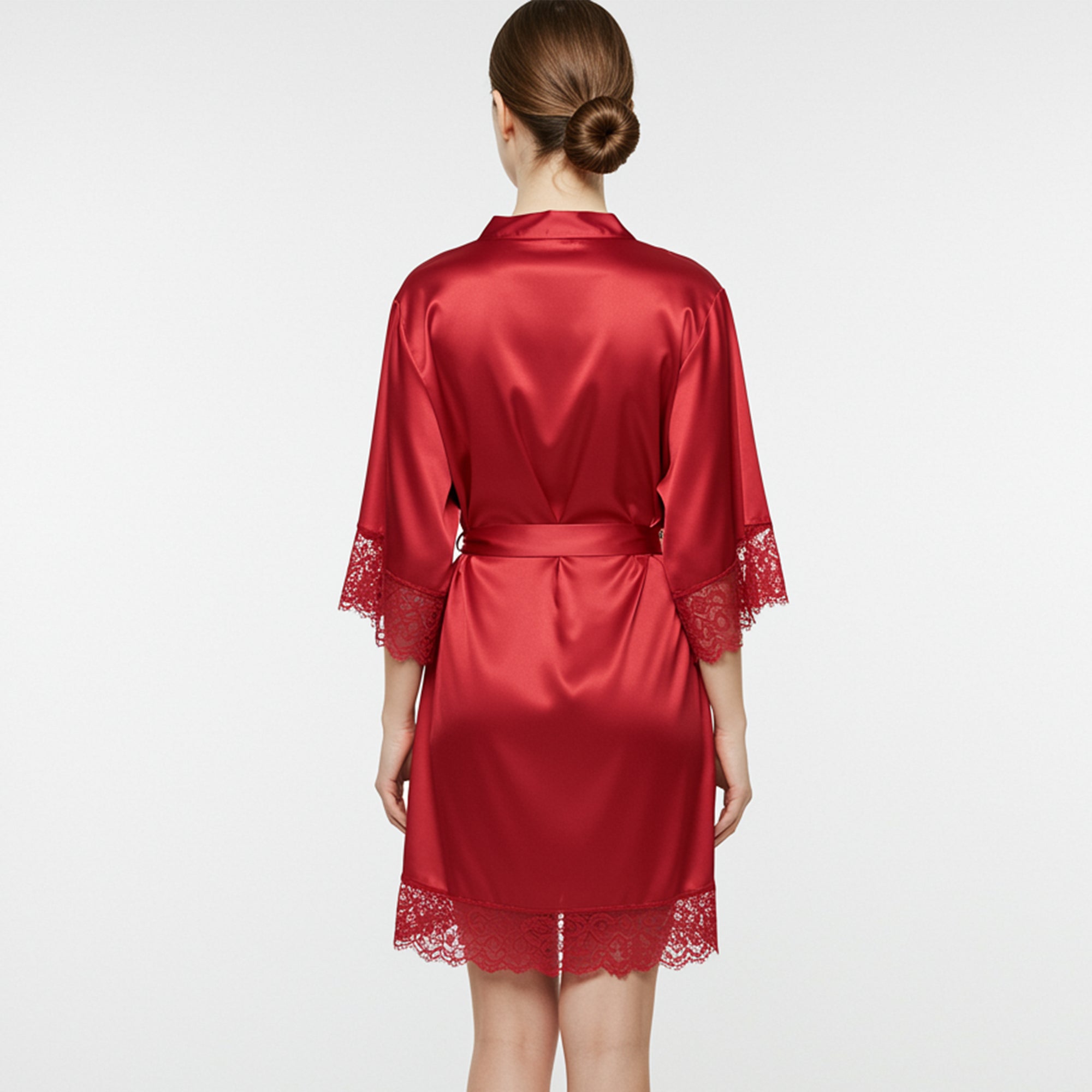 Back view of women’s red satin robe with lace trim and waist belt