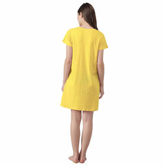 wearing a knee-length yellow cotton sleeptshirt